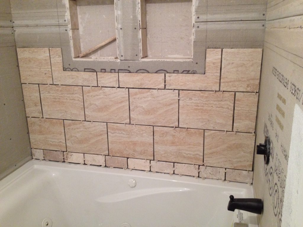 A full bathroom tear out and renovation, complete with tile shower, new vanity, and décor. Check out this bathroom renovation!