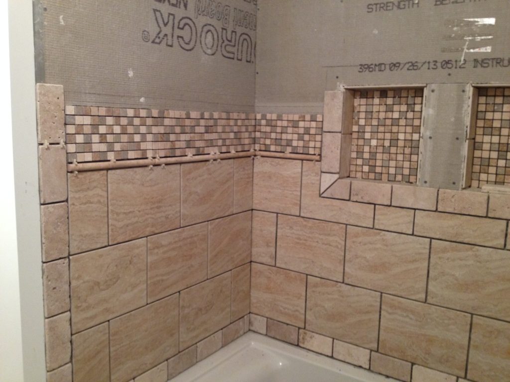 A full bathroom tear out and renovation, complete with tile shower, new vanity, and décor. Check out this bathroom renovation!