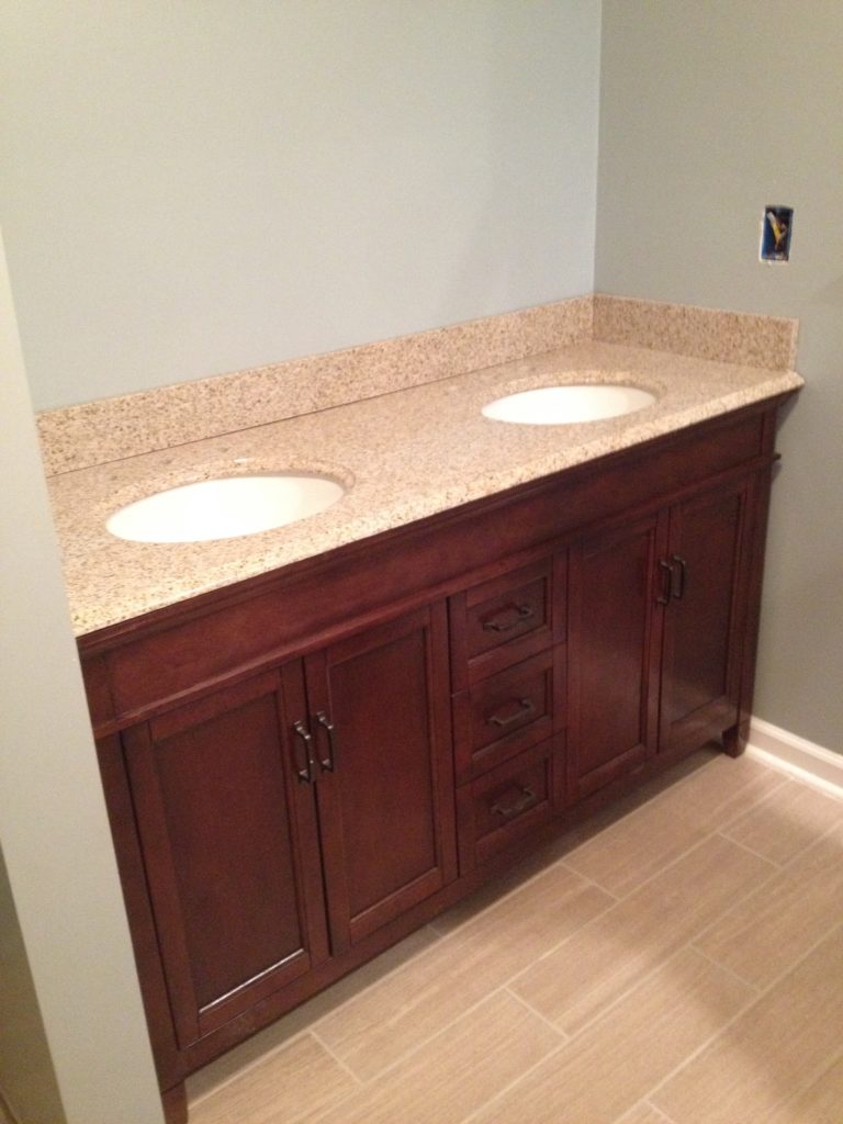 A full bathroom tear out and renovation, complete with tile shower, new vanity, and décor. Check out this bathroom renovation!