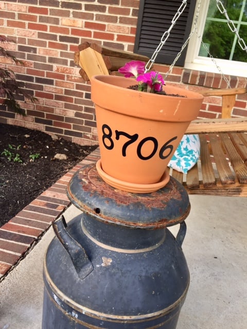 A great spring DIY project! Painted terra cotta flower pots are an easy way to update your home and garden for spring on a budget!