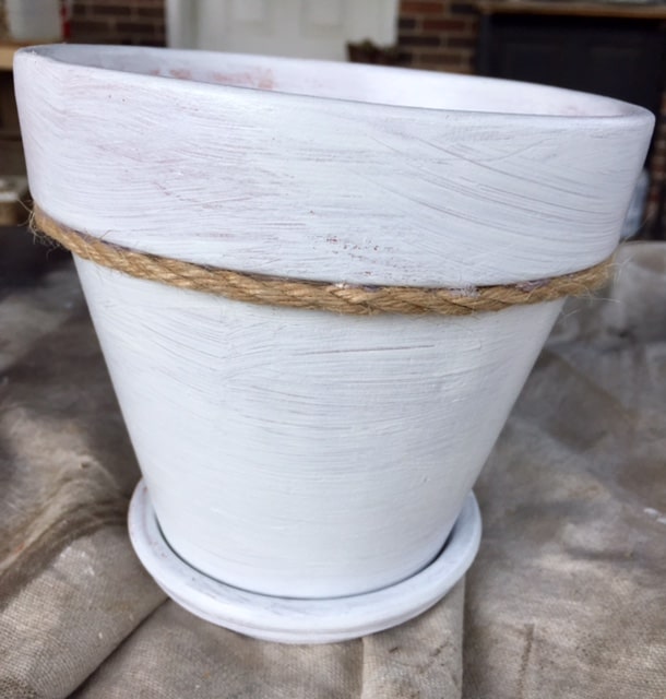 A great spring DIY project! Painted terra cotta flower pots are an easy way to update your home and garden for spring on a budget!