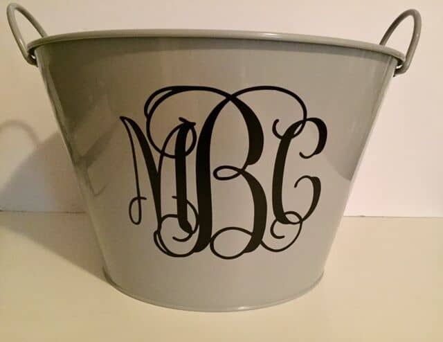 This is a great beginner project for Cricut crafters! Learn how to make a monogram drink bucket for a gift basket, bridal shower, or party drink bucket!