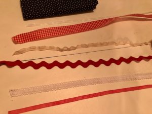 Decorate for the 4th of July with an American ribbon flag. With just a few supplies and this easy step by step tutorial, you'll have a ribbon flag made in about 30 minutes.