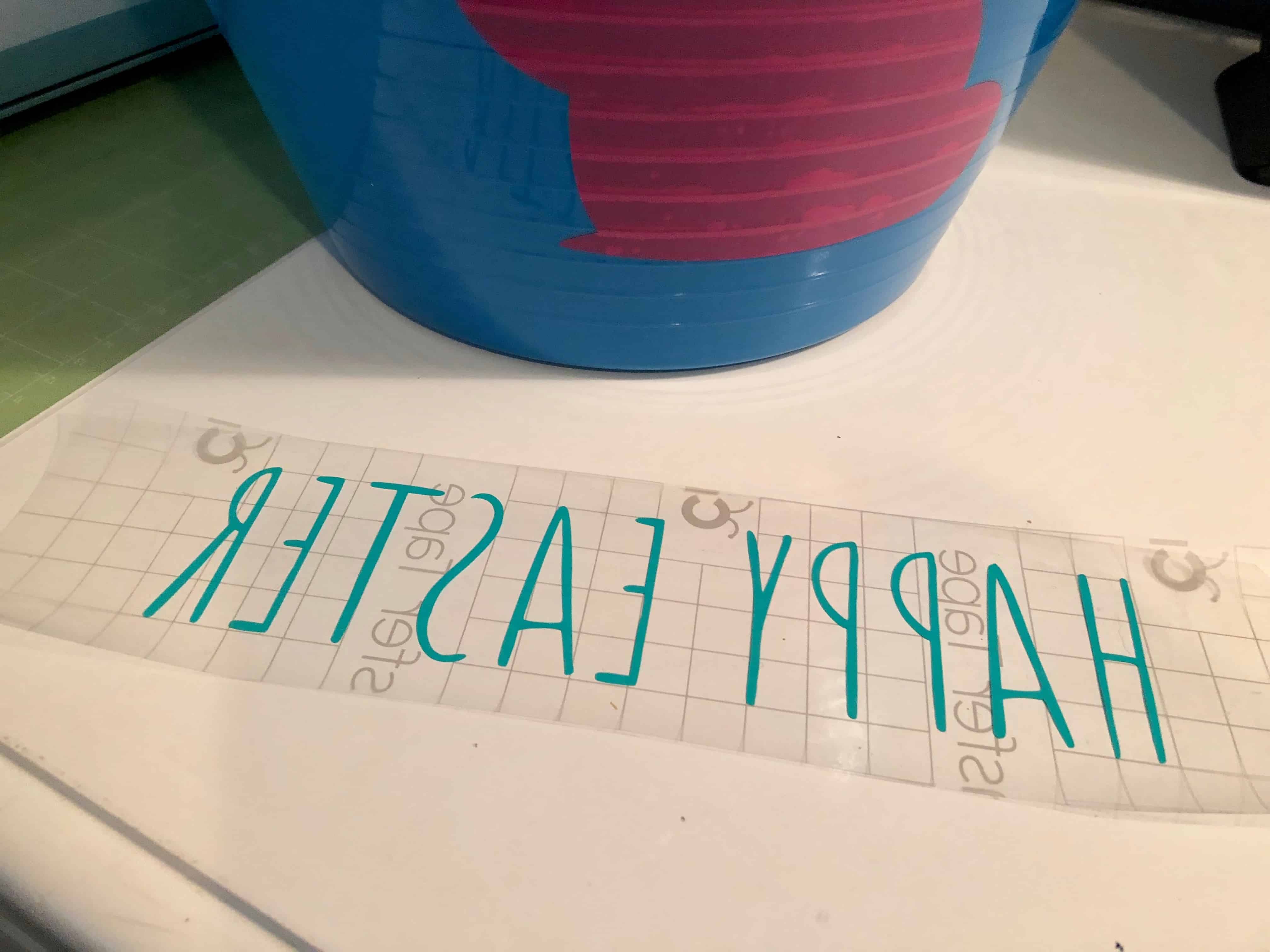 Make your own DIY Easter bucket with the Cricut Explore easily and very affordably. This super cheap and easy DIY Easter project is so fun to make. Fill your DIY Easter basket with items from the Dollar Tree for a frugal Easter present.