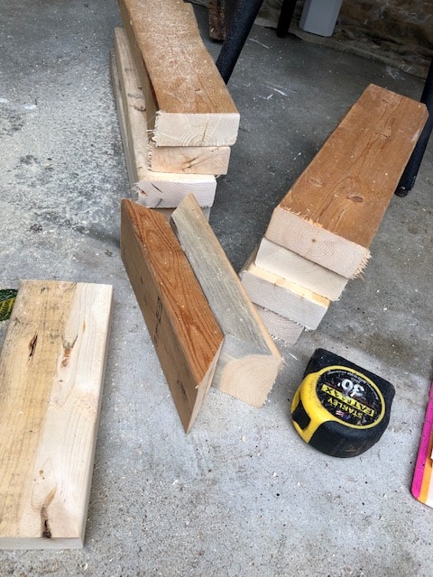 Make this farmhouse DIY dining room bench for under $20! Perfect for small spaces, front porches, and to add extra seating with storage underneath. 