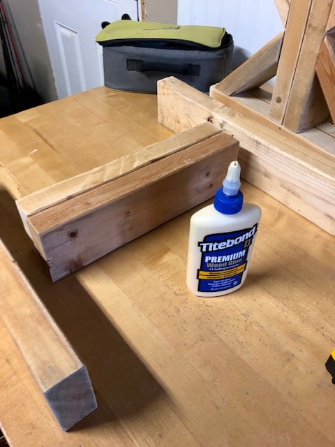 Make this farmhouse DIY dining room bench for under $20! Perfect for small spaces, front porches, and to add extra seating with storage underneath. 