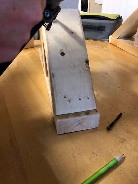 Make this farmhouse DIY dining room bench for under $20! Perfect for small spaces, front porches, and to add extra seating with storage underneath. 