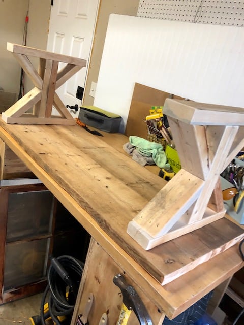 Make this farmhouse DIY dining room bench for under $20! Perfect for small spaces, front porches, and to add extra seating with storage underneath. 