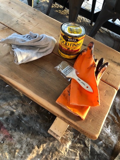 Make this farmhouse DIY dining room bench for under $20! Perfect for small spaces, front porches, and to add extra seating with storage underneath. 