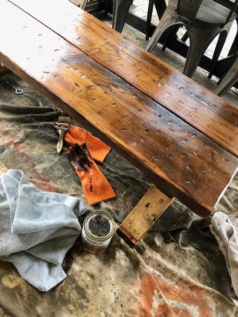Make this farmhouse DIY dining room bench for under $20! Perfect for small spaces, front porches, and to add extra seating with storage underneath. 