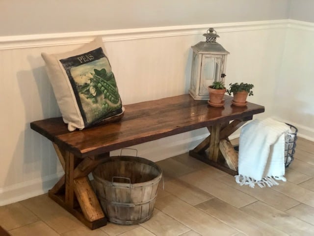 Make this farmhouse DIY dining room bench for under $20! Perfect for small spaces, front porches, and to add extra seating with storage underneath. 