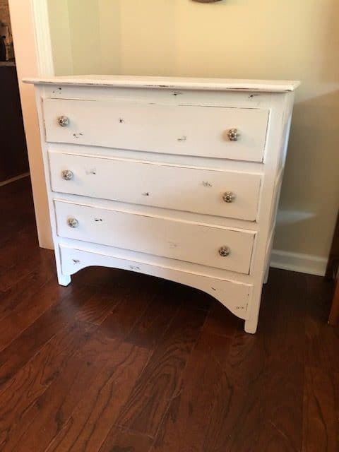 This DIY yard sale dresser makeover was simple and I love the white rustic, farmhouse, vintage look of it! Check it out for ideas for your own DIY!