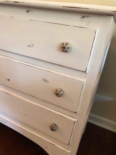 This DIY yard sale dresser makeover was simple and I love the white rustic, farmhouse, vintage look of it! Check it out for ideas for your own DIY!