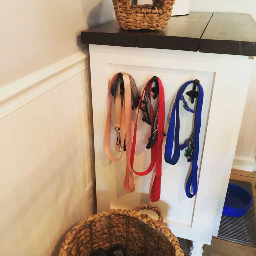 We made this DIY dog food station for dog food storage for food, treats, and toys. The pull out drawer is perfect for scooping dog food. Organize dog food