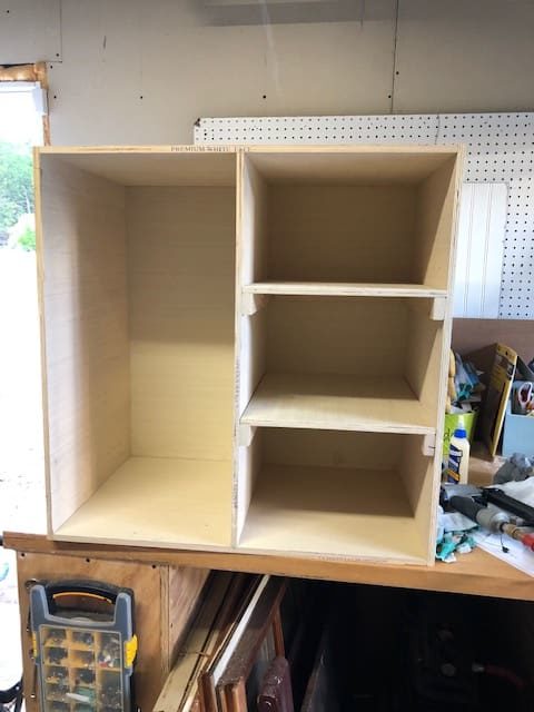 We made this DIY dog food station for dog food storage for food, treats, and toys. The pull out drawer is perfect for scooping dog food. Organize dog food