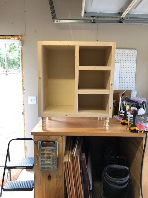 We made this DIY dog food station for dog food storage for food, treats, and toys. The pull out drawer is perfect for scooping dog food. Organize dog food