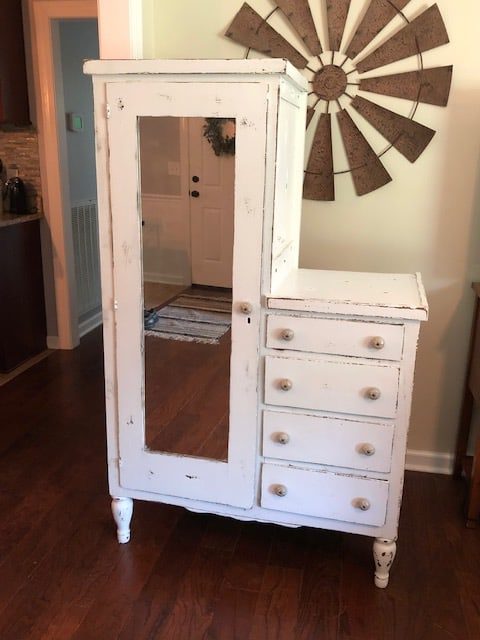 Check out the amazing before and after of this DIY armoire makeover! White, farmhouse, antique and perfect for the bedroom or kitchen with storage ideas!