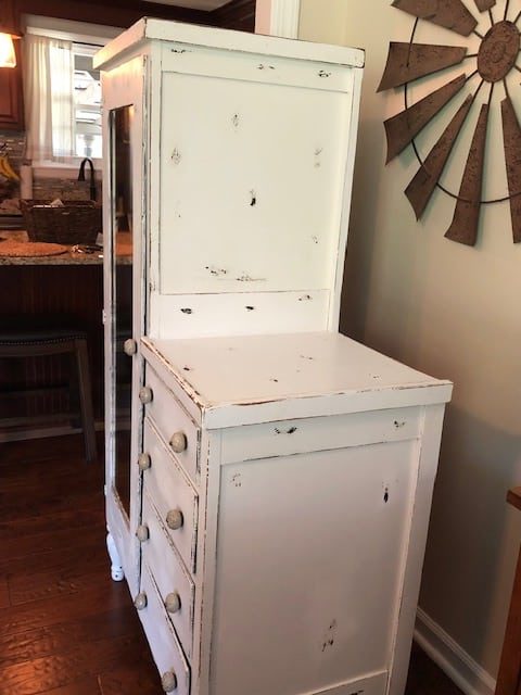 Check out the amazing before and after of this DIY armoire makeover! White, farmhouse, antique and perfect for the bedroom or kitchen with storage ideas!