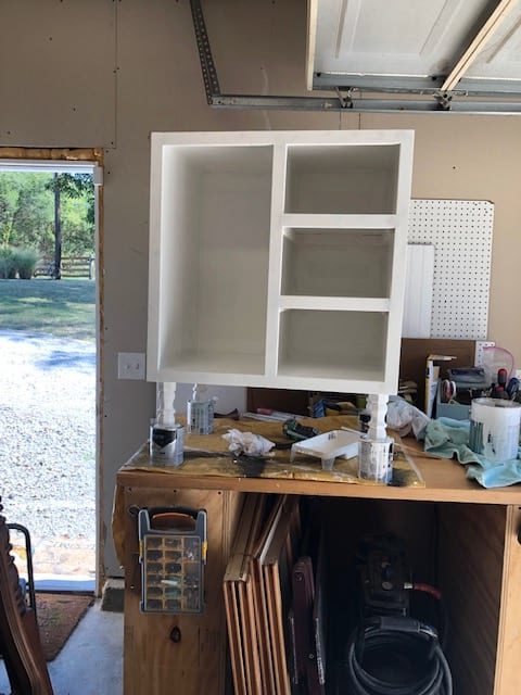 We made this DIY dog food station for dog food storage for food, treats, and toys. The pull out drawer is perfect for scooping dog food. Organize dog food