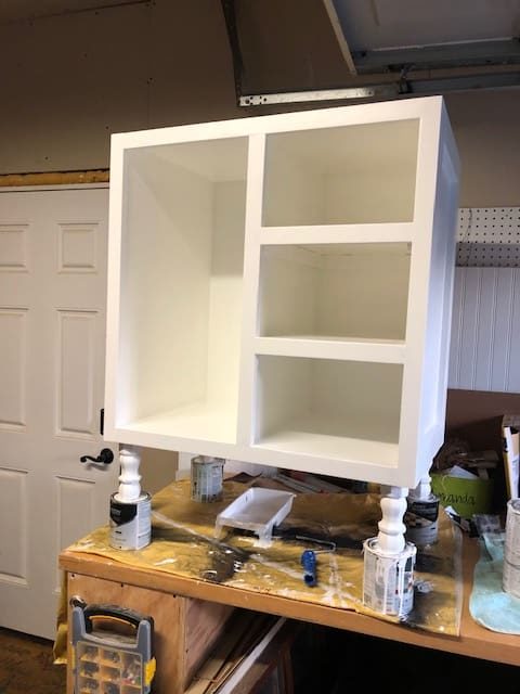 We made this DIY dog food station for dog food storage for food, treats, and toys. The pull out drawer is perfect for scooping dog food. Organize dog food