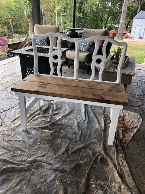 Learn how to make a DIY headboard bench with this step by step, easy tutorial and plan. Take an old headboard and repurpose it to a bench!