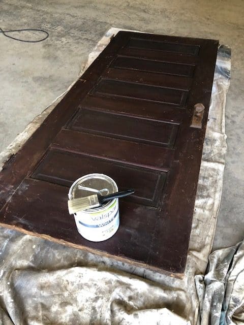 See how I made a DIY day bed on a budget with this tutorial. I used an old vintage door to create a headboard and built a wooden day bed frame.