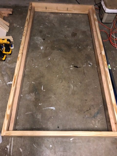 See how I made a DIY day bed on a budget with this tutorial. I used an old vintage door to create a headboard and built a wooden day bed frame.