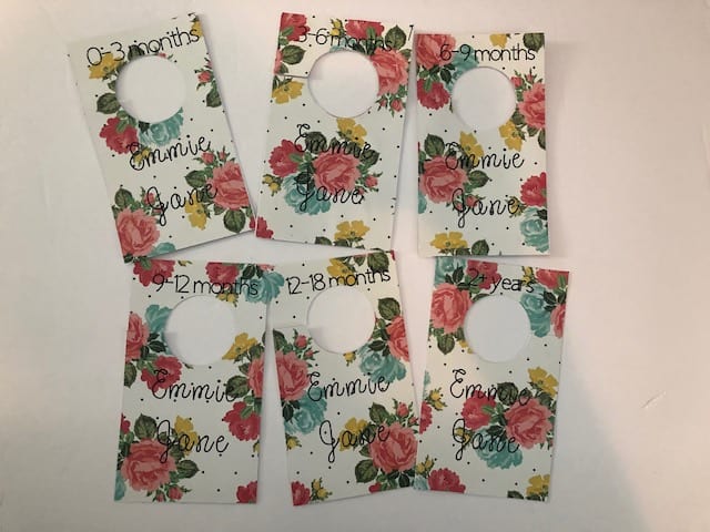 Learn how to make your own DIY closet dividers to organize your baby's or kid's clothes by size. These hanging dividers are perfect for nursery organization