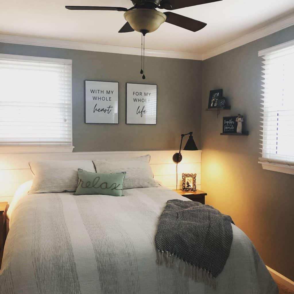 This budget friendly bedroom makeover was so fun to create with Walmart decor, DIY wall art, a gallery wall, frugal bedding, and wall sconces.