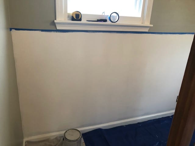 See how we made this easy and budget friendly DIY shiplap headboard wall for our bedroom makeover. Full materials list and step by step directions!