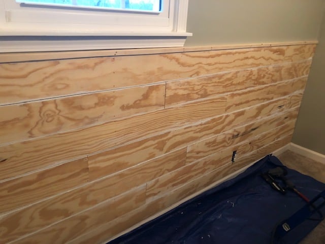 See how we made this easy and budget friendly DIY shiplap headboard wall for our bedroom makeover. Full materials list and step by step directions!