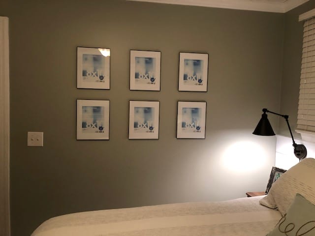 See how we made a DIY cheap gallery wall with these affordable Walmart frames. Perfect for a bedroom, hallway, living room, or kitchen.