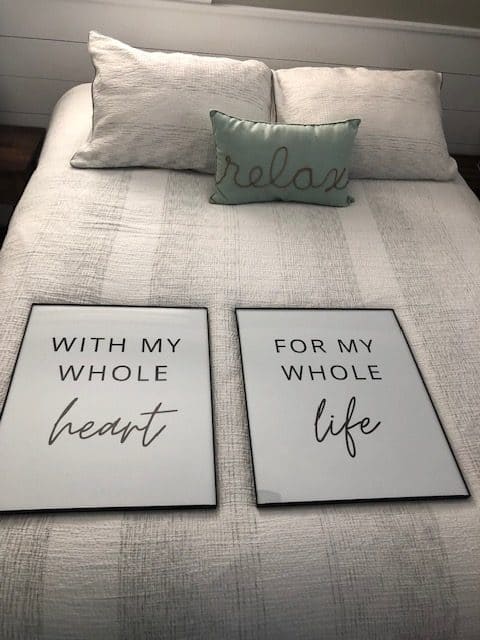 This budget friendly bedroom makeover was so fun to create with Walmart decor, DIY wall art, a gallery wall, frugal bedding, and wall sconces.