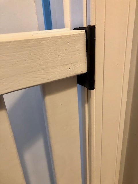This DIY baby gate project was easy and affordable to make. It works great as a dog gate or pet gate, too. Full step by step tutorial and plans to make it!