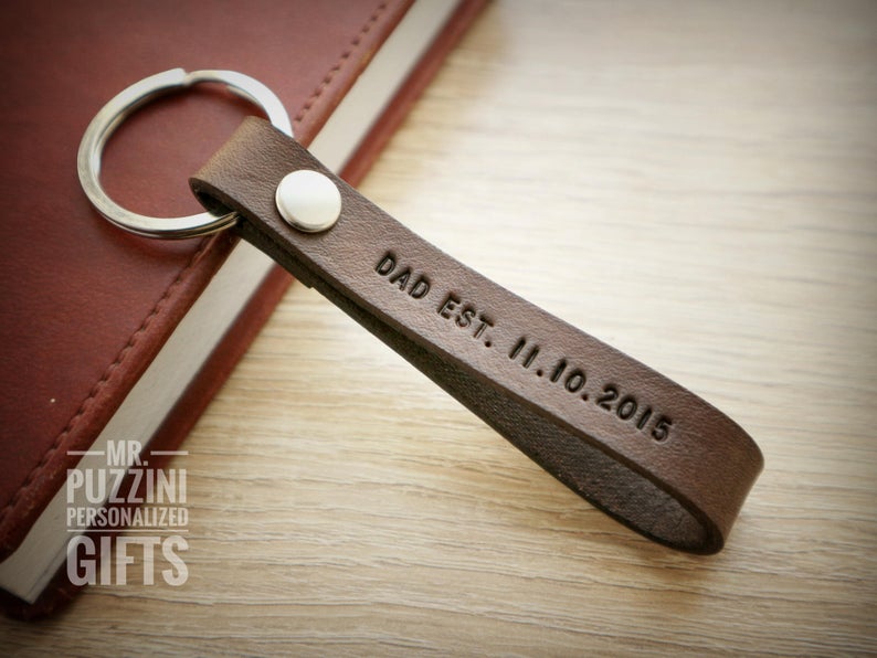 Check out this list of 21 first Father's Day gift ideas to find the perfect gift for new dads. Personalized gifts, custom photo gifts, and more!