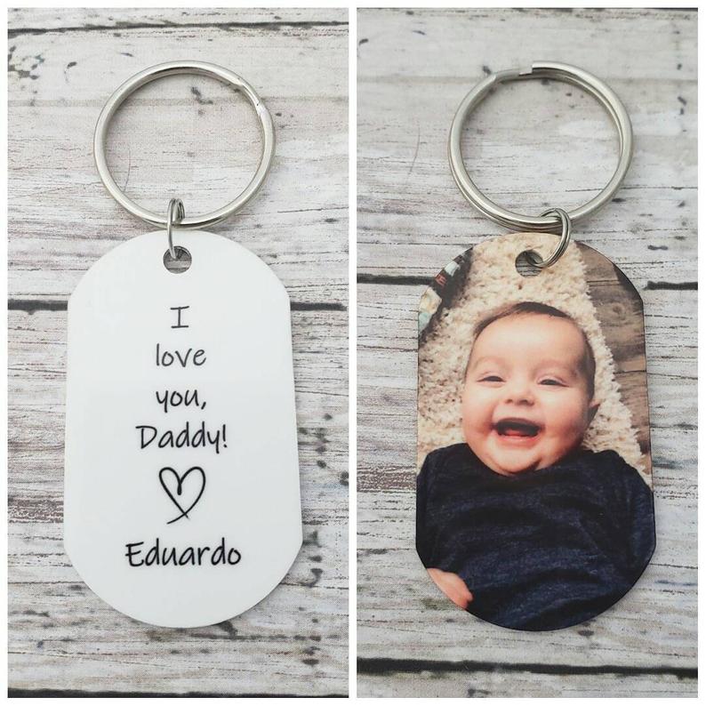 Check out this list of 21 first Father's Day gift ideas to find the perfect gift for new dads. Personalized gifts, custom photo gifts, and more!