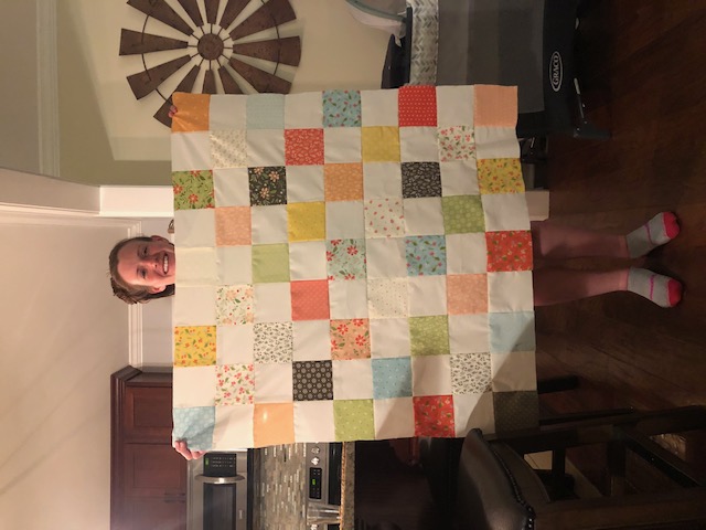 This beginner level DIY baby quilt was so fun and easy to make. You can make your own simple homemade baby quilt with pre cut squares, too.