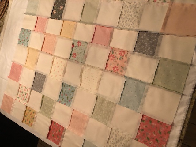 This beginner level DIY baby quilt was so fun and easy to make. You can make your own simple homemade baby quilt with pre cut squares, too.