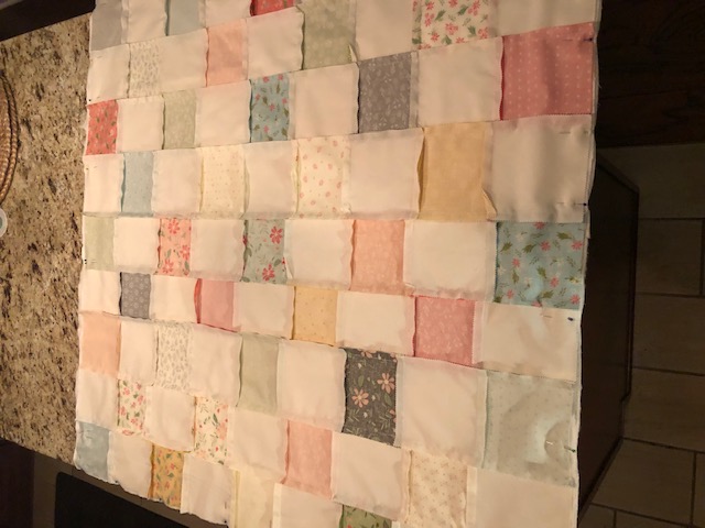 This beginner level DIY baby quilt was so fun and easy to make. You can make your own simple homemade baby quilt with pre cut squares, too.