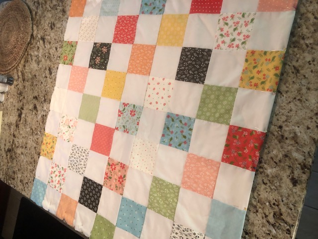 This beginner level DIY baby quilt was so fun and easy to make. You can make your own simple homemade baby quilt with pre cut squares, too.