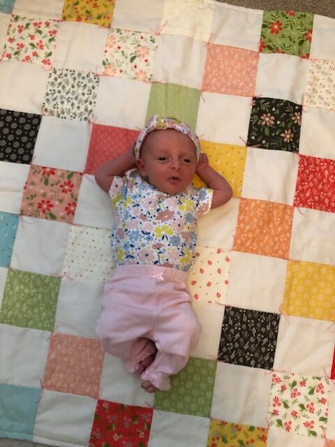 This beginner level DIY baby quilt was so fun and easy to make. You can make your own simple homemade baby quilt with pre cut squares, too.