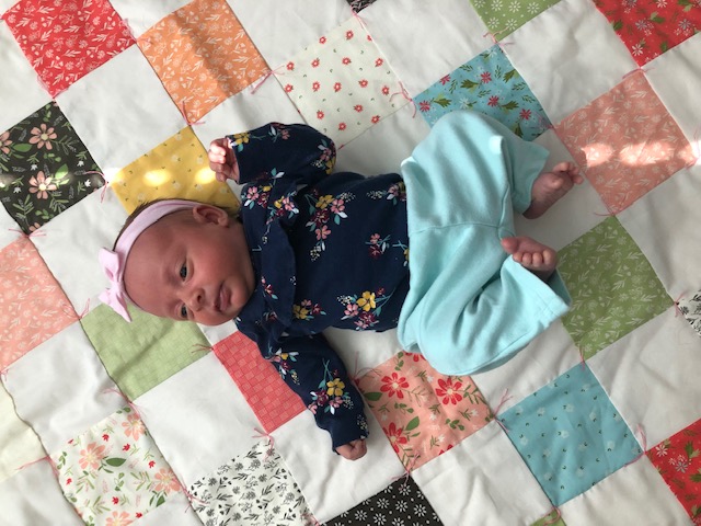 This beginner level DIY baby quilt was so fun and easy to make. You can make your own simple homemade baby quilt with pre cut squares, too.