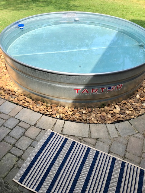 Our DIY stock tank pool is done! I love our backyard so much with our awesome new swimming pool. Learn how to make a stock tank pool in this post!