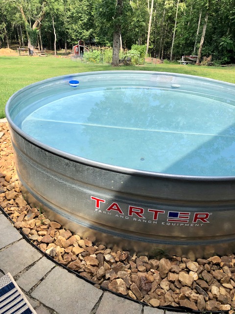 Are stock tank pools worth it? 100% yes! Check out our backyard paradise and learn how to make a stock tank swimming pool.