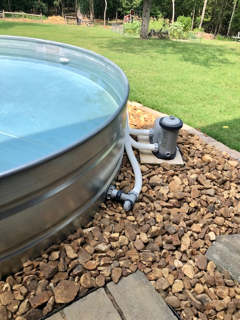 Are stock tank pools worth it? 100% yes! Check out our backyard paradise and learn how to make a stock tank swimming pool.