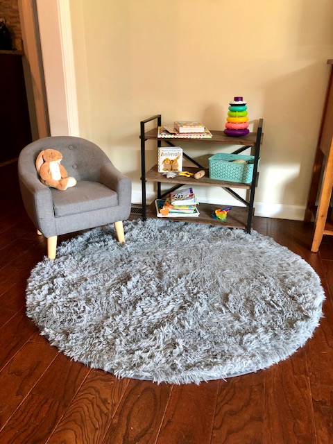 Make a baby play area in a living room, even in a small house, to give your child their own space and keep the clutter down.