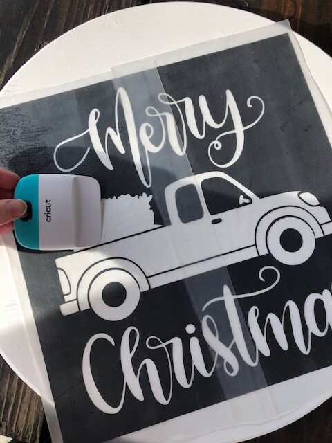 Make this simple, quick, and easy $10 DIY Christmas wooden door hanger with your Cricut machine. Perfect for DIY Christmas decor or a DIY gift!