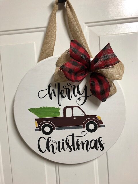 Make this simple, quick, and easy $10 DIY Christmas wooden door hanger with your Cricut machine. Perfect for DIY Christmas decor or a DIY gift!