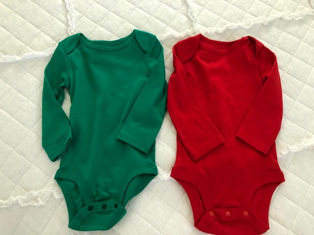 Make your own DIY Christmas bodysuits for baby with this easy beginner Cricut project. These simple iron on designs are quick to make and so cute!