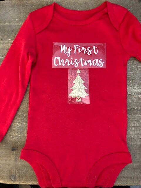 Make your own DIY Christmas bodysuits for baby with this easy beginner Cricut project. These simple iron on designs are quick to make and so cute!